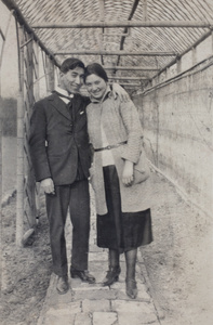 Tom and Sarah Hutchinson standing under the newly built trellis in the garden, 35 Tongshan Road, Hongkou, Shanghai