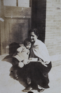 Bea and Sarah Hutchinson sitting on the verandah steps, 35 Tongshan Road, Hongkou, Shanghai