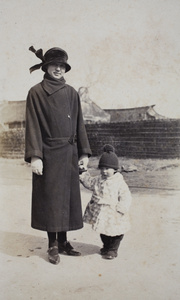 Sarah and Bea Hutchinson wearing winter coats, Shanghai