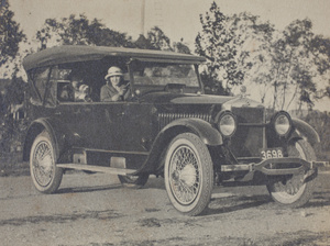 Margie Hutchinson behind the steering wheel of her Studebaker Six automobile, with Sarah and Bea in the back seat, Wusong