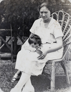 Sarah and Bea Hutchinson sitting outside the wooden summer house, 35 Tongshan Road, Hongkou, Shanghai