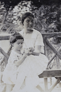 Sarah and Bea Hutchinson sitting in the wooden summer house, 35 Tongshan Road, Hongkou, Shanghai