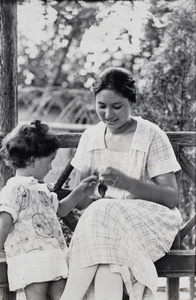 Sarah and Bea Hutchinson sitting in the wooden summer house, 35 Tongshan Road, Hongkou, Shanghai