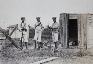 Italian Royal Navy sailors from RM Libia with rifles and a water cooled machine gun at a checkpoint, Shanghai, 1924