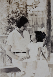 Sarah and Bea Hutchinson sitting in the wooden summer house, 35 Tongshan Road, Hongkou, Shanghai