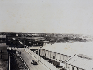 View from a rooftop lookout towards industrial buildings and coal yards, Shanghai