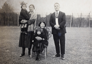 Bea and Sarah Hutchinson with the Kirby family in the garden, 35 Tongshan Road, Hongkou, Shanghai