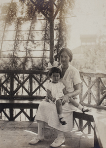 Bea and Sarah Hutchinson sitting in the wooden summer house, 35 Tongshan Road, Hongkou, Shanghai