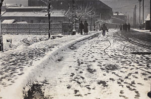 Snow falling and people walking along Tongshan Road, Hongkou, Shanghai