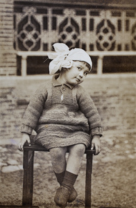 Bea Hutchinson wearing a handknitted dress and knotted headscarf, 35 Tongshan Road, Hongkou, Shanghai