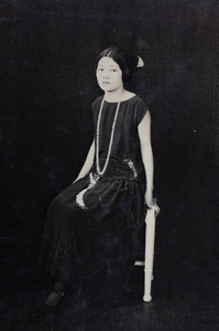 Unidentified woman wearing a fashionable dress and long necklace, Hongkou, Shanghai