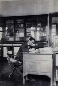 John Piry working at an office desk, Shanghai