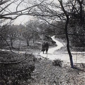 Sonia Gotfried and Sarah Hutchinson walking along a path, Jessfield Park, Shanghai, April 1925