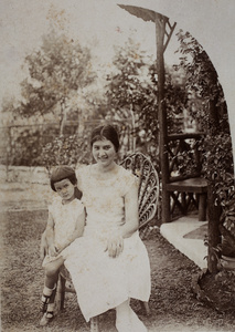 Bea and Sarah Hutchinson sitting near the garden summerhouse, 35 Tongshan Road, Hongkou, Shanghai