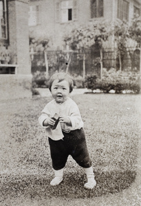 Gladys Hutchinson standing up in the garden, 35 Tongshan Road, Hongkou, Shanghai