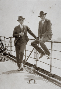 Bill Hutchinson standing on the deck of O.S.K. 'Africa Maru' with an unidentified man, Shanghai