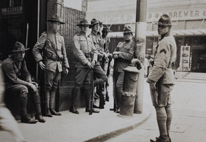 American Company Shanghai Volunteer Corps members on duty with rifles, Shanghai, 1925