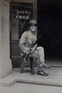 Mr Atiyeh, American Company Shanghai Volunteer Corps member, on duty at the entrance to the Navy YMCA, Shanghai, 1925