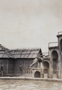 Diving from a high platform into the Open Air Pool, Hongkou, Shanghai