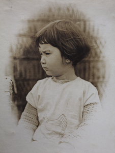 Bea Hutchinson wearing a garment decorated with a chicken design, 35 Tongshan Road, Hongkou, Shanghai