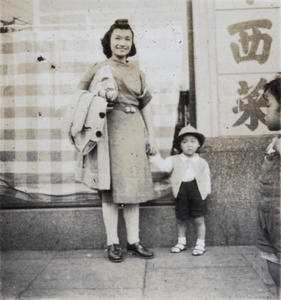 Lucy and Roy Hutchinson outside a shop, Shanghai