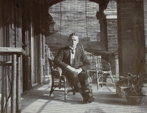 Man on a veranda, Hong Kong