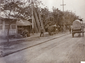 Peking cart, camels and poles, Peking