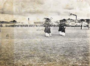 Sikh troops playing bagpipes, Hong Kong