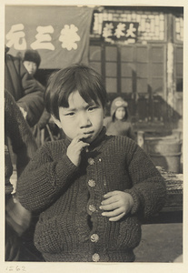 Child wearing a cardigan sweater