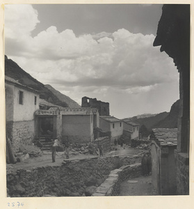 Houses, terraced walls, and street with villagers in Tio-liu-po Village [sic]