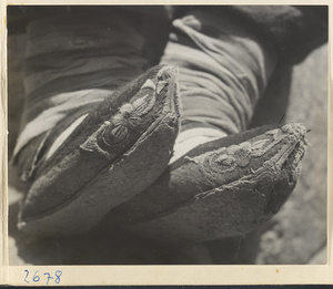 Woman wearing embroidered shoes in the Lost Tribe country