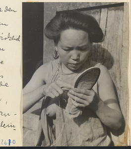 Woman with earrings sewing a shoe in the Lost Tribe country