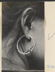 Woman wearing engraved hoop earring in the Lost Tribe country