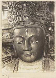 Detail showing head of Buddha statue with third eye in Da cheng ge at Da Fo si