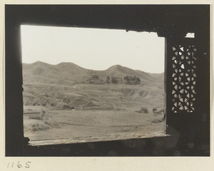 View from a window of Pu du dian at Yi li miao showing a general view of Pu luo si