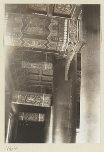 Interior view of Pu du dian at Yi li miao showing columns and painted beams