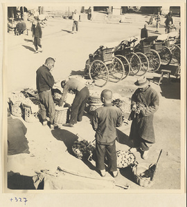 Street scene with produce market and rickshaw stand in Baoding