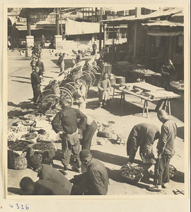 Street scene with produce market and rickshaw stand in Baoding