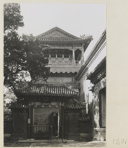 Courtyard with a small gate leading to a multi-storied single-eaved pavilion in the Forbidden City