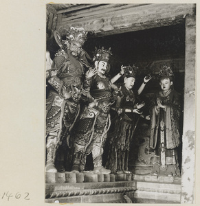 Statues of two heavenly kings (left), a multi-armed Bodhisattva, and a shrine figure at Da Fo si