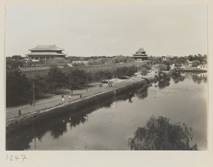 Moat, wall, gate with double-eaved roof, and corner watchtower of the Forbidden City