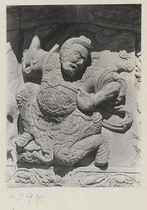 Detail of marble relief carving showing a male figure at Yuquan Hill