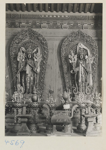 Interior of temple building at Yong he gong showing altars with Lamaist deities