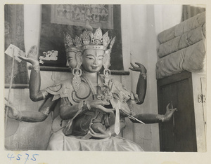 Interior of temple building at Yong he gong showing multi-headed Lamaist deity with six arms