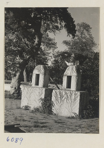 Two stone altars with relief carvings of waves and mountains at Xian nong tan