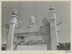 Detail of Long feng men showing stone lintel and columns topped by qi lin