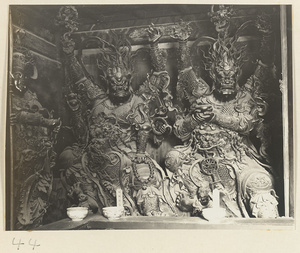Temple guardian figures with multiple arms at Xi yu si