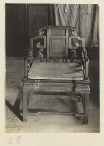 Wooden chair with padded seat at Xi yu si