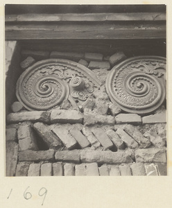 Interior detail of storied wooden pagoda at Tian ning si showing scroll-shaped ceramic reliefs