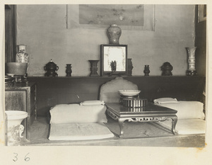 Temple interior at Xi yu si showing room with a kang and decorative objects
